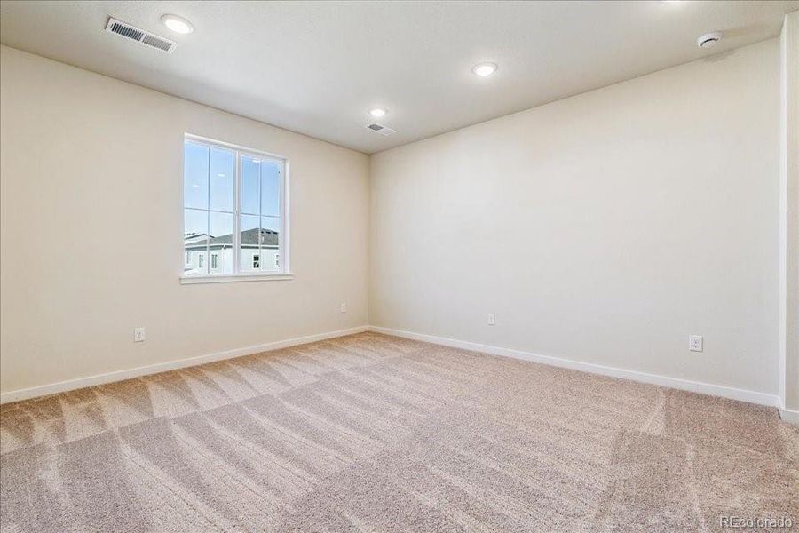 Spacious, unfurnished interior of a new home in Floret Collection at Alder Creek, Parker (Image 19).