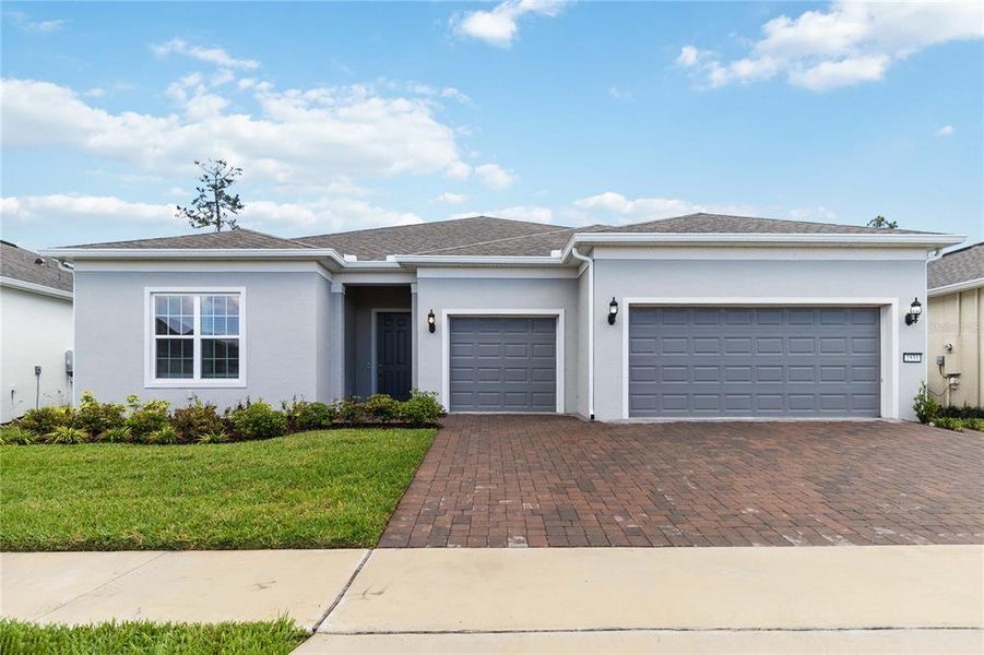 Front exterior of a new home in Del Webb Sunbridge, St. Cloud, FL, highlighting curb appeal (Image 28).