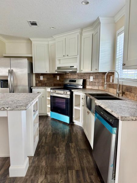 Furnished interior view inside a new home in , Okeechobee (Image 2).