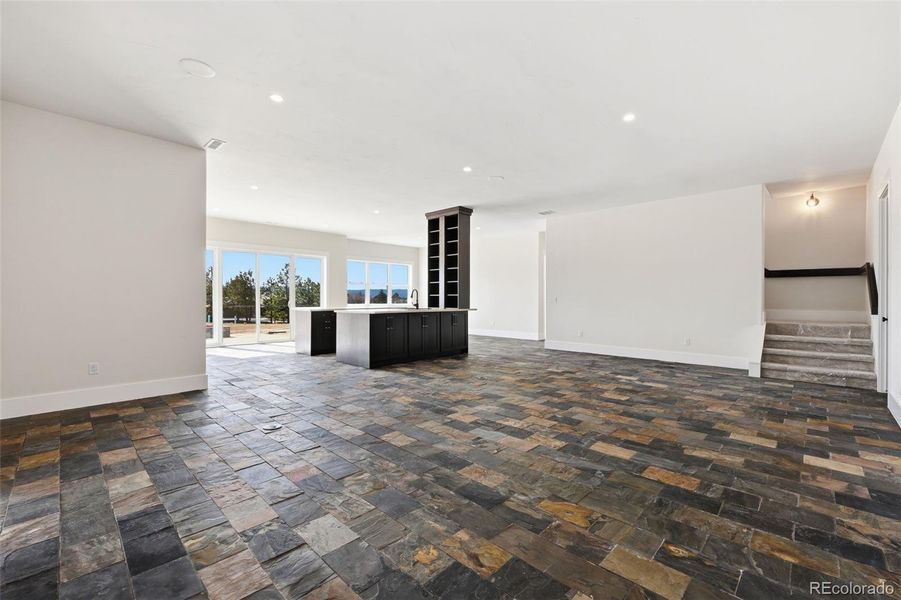 Family Room with stairwell leading up to main level Family Room with stairwell leading up to main level