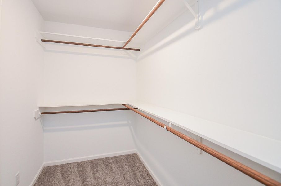 Oversized walk-in closet with smart shelving—plenty of space to stay organized.