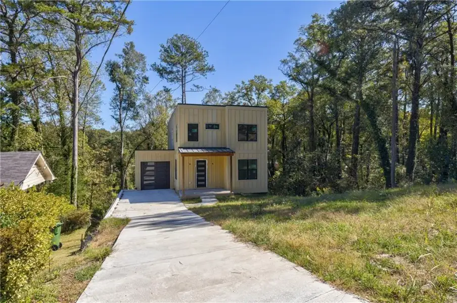 Front exterior of a new home in , Hapeville, GA, highlighting curb appeal (Image 7).