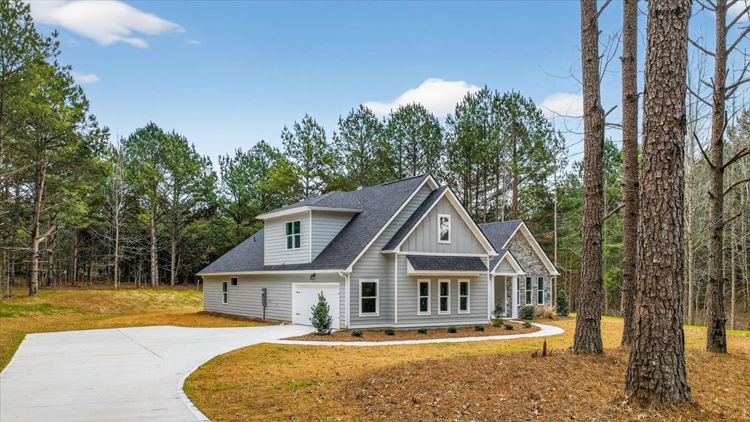 Front exterior of a new home in White Oaks, The Rock, GA, highlighting curb appeal (Image 22). Front exterior of a new home in White Oaks, The Rock, GA, highlighting curb appeal (Image 22).