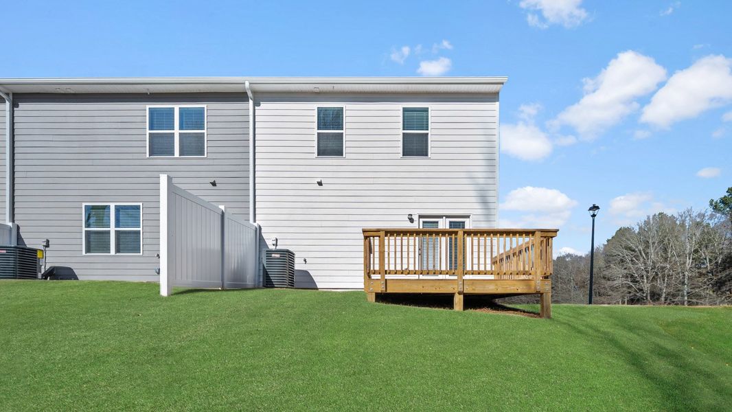 Exterior details and patio area of a home in Inverness at Sugarloaf, Lawrenceville (Image 3).