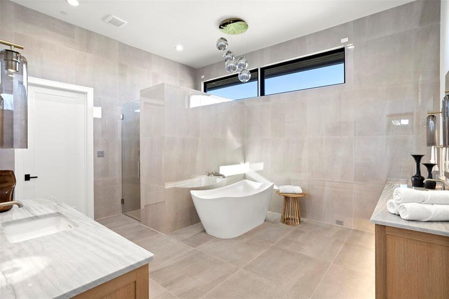 Large soaking tub in the primary suite and large walk in shower.