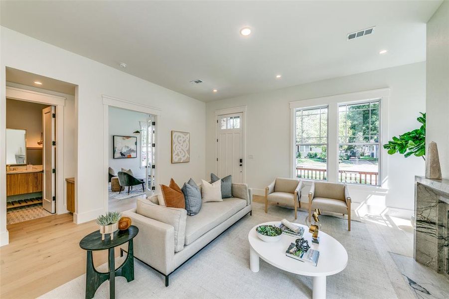 Living room with light hardwood / wood-style floors