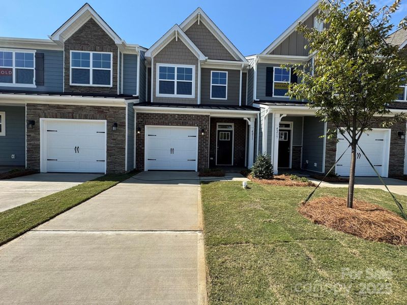 Front exterior of a new home in Harrisburg Village, Harrisburg, NC, highlighting curb appeal (Image 11).