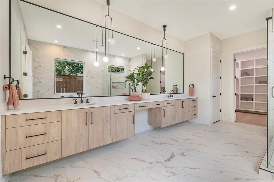 Bathroom featuring dual vanity and tile patterned floors