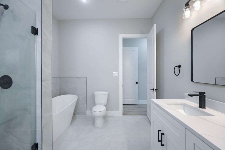 Double vanities in both bathrooms offer functionality and comfort