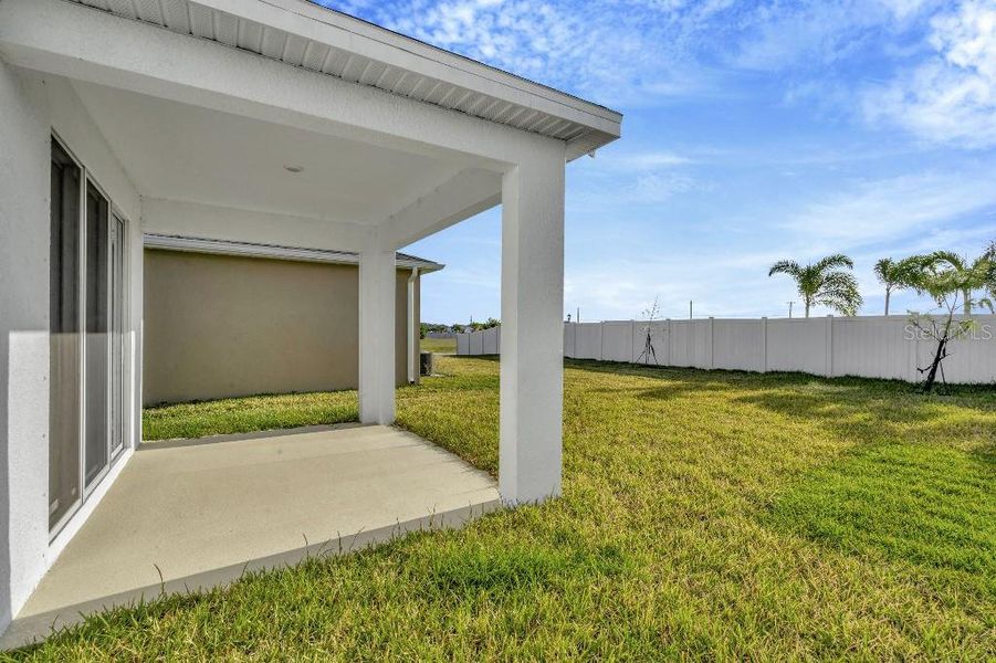 Exterior details and patio area of a home in Mangrove Manor, Apollo Beach (Image 3).