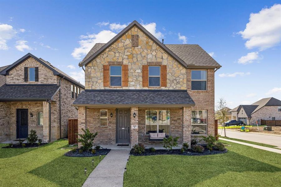 Front exterior of a new home in Solterra, Mesquite, TX, highlighting curb appeal (Image 22). Front exterior of a new home in Solterra, Mesquite, TX, highlighting curb appeal (Image 22).