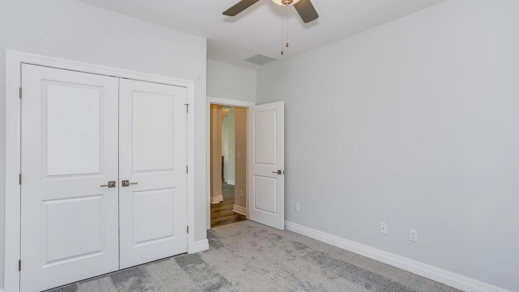 Representative unfurnished interior of a home built from the Portico Tandem Garage by Perfection Builders in The Courtyards at The Heritage, Andover (Image 22).