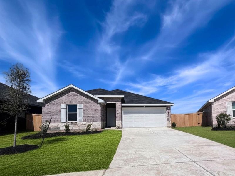 Front exterior of a new home in Maple Woods, Hockley, TX, highlighting curb appeal (Image 1). Front exterior of a new home in Maple Woods, Hockley, TX, highlighting curb appeal (Image 1).