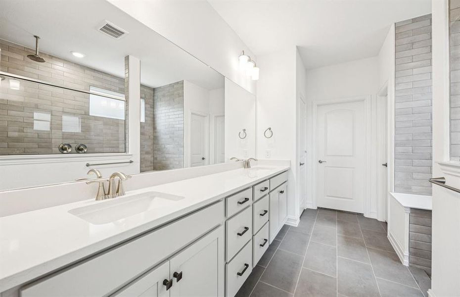Owner's suite bath with a luxurious deep walk-in shower *Real home pictured Owner's suite bath with a luxurious deep walk-in shower *Real home pictured