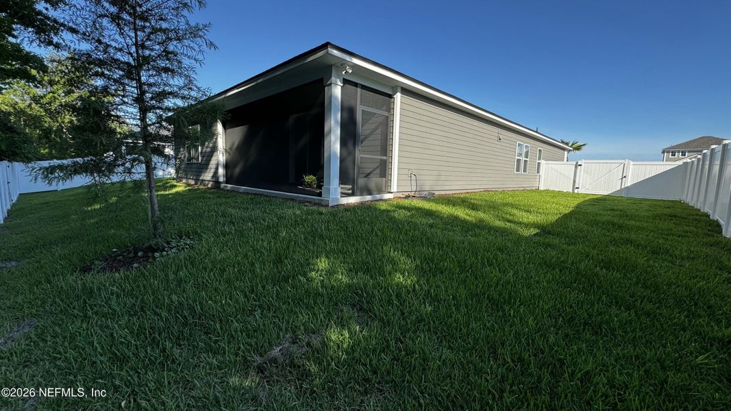 Exterior details and patio area of a home in McGirt's Creek, Yulee (Image 13).