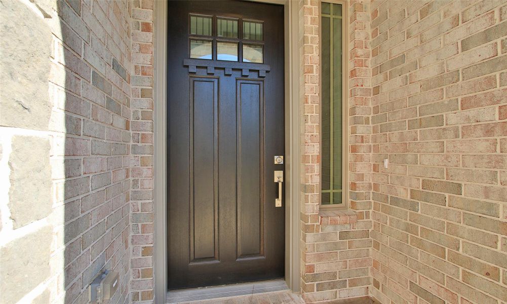 Exterior details and patio area of a home in The Woodlands Hills, Willis (Image 22).