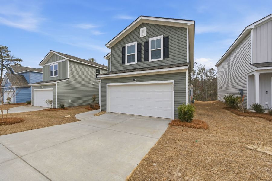 Front exterior of a new home in Grand Arbor, Blythewood, SC, highlighting curb appeal (Image 18).