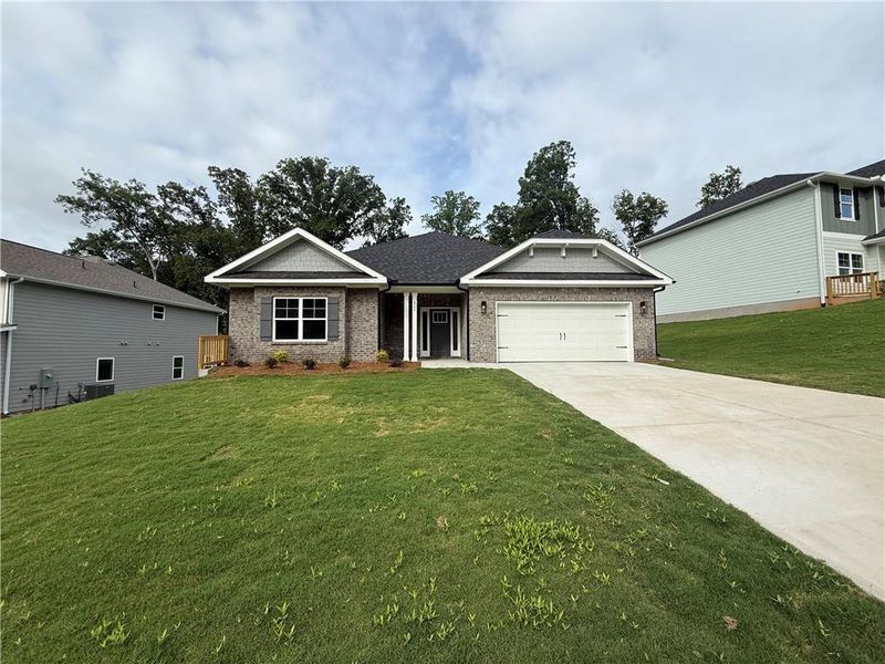 Front exterior of a new home in Thunder Ridge, Dawsonville, GA, highlighting curb appeal (Image 22).