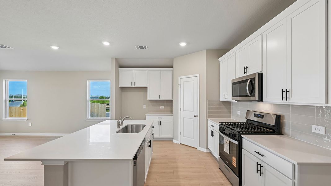 Furnished interior view inside a new home in Carillon, Manor (Image 6).
