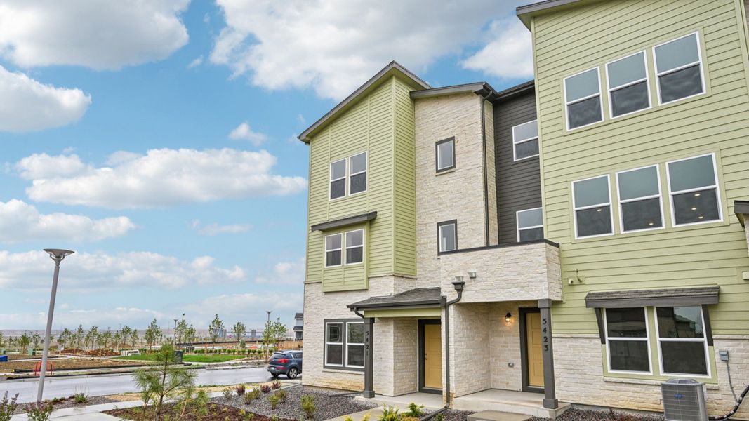 Front exterior of a new home in Windler Townhomes, Aurora, CO, highlighting curb appeal (Image 2). Front exterior of a new home in Windler Townhomes, Aurora, CO, highlighting curb appeal (Image 2).