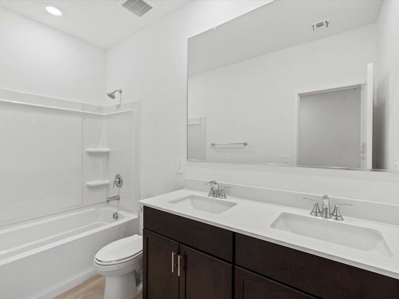 Furnished interior view inside a new home in Mountain View Estates Reserve Series, Buckeye (Image 6).