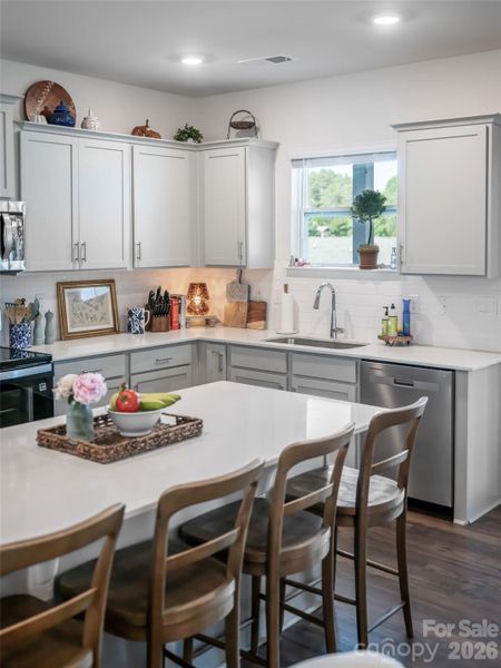 Kitchen with spacious island and upgraded countertops! Kitchen with spacious island and upgraded countertops!