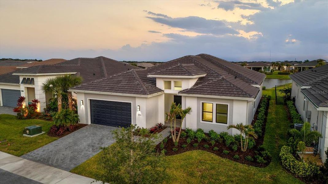 Front exterior of a new home in , Sarasota, FL, highlighting curb appeal (Image 29).