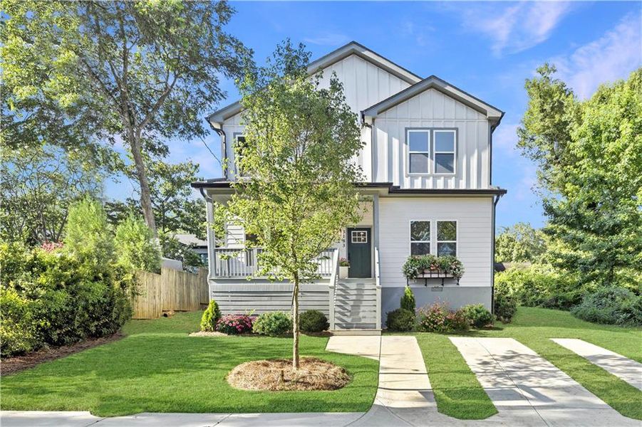 Front exterior of a new home in , Scottdale, GA, highlighting curb appeal (Image 1).