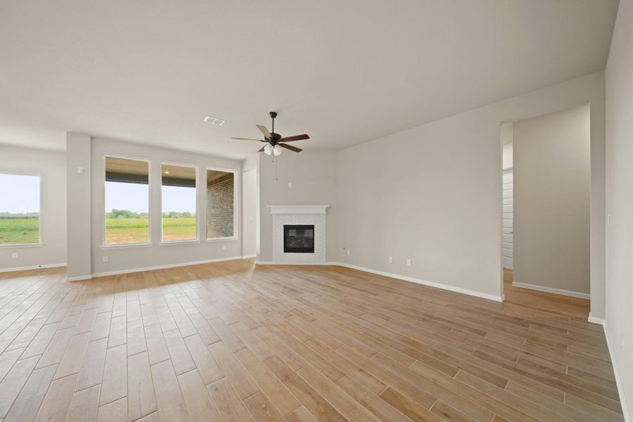 Great room with cozy fireplace (*Photo not of actual home and used for illustration purposes only.)