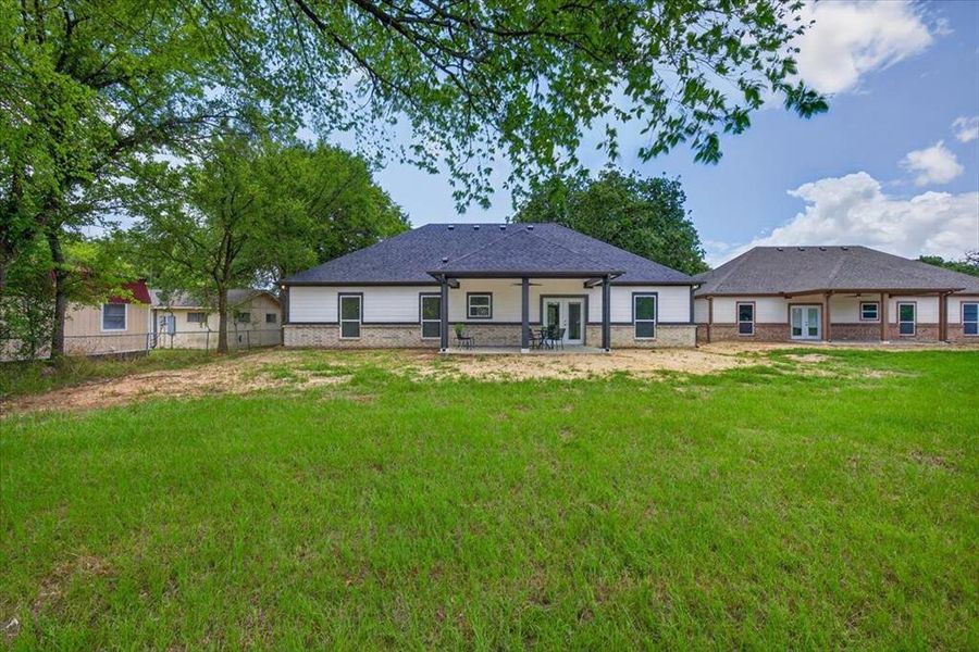 Expansive green lawn for outdoor activities.