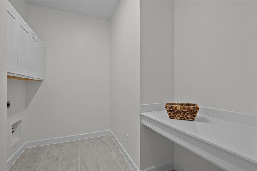 EXAMPLE PHOTO:  Large utility room with upper cabinets & folding counter.