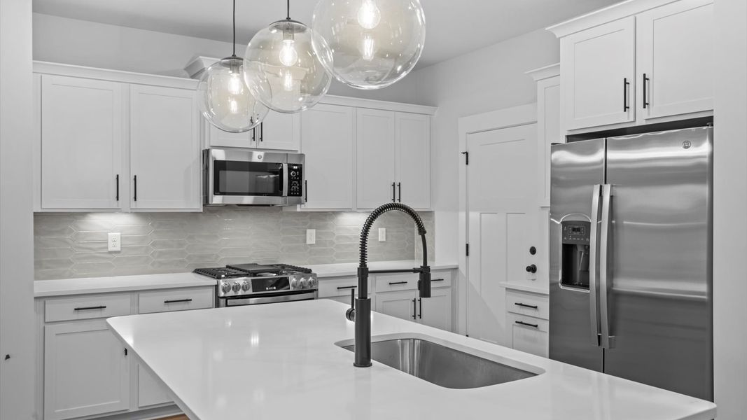 Accomplished design in a kitchen that blends function and form with a right-sized island