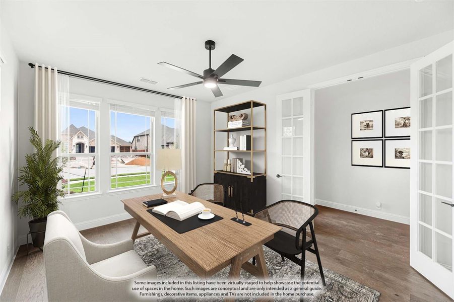 Home office with wood desk, ceiling fan, hardwood floors, and French doors with large windows Home office with wood desk, ceiling fan, hardwood floors, and French doors with large windows