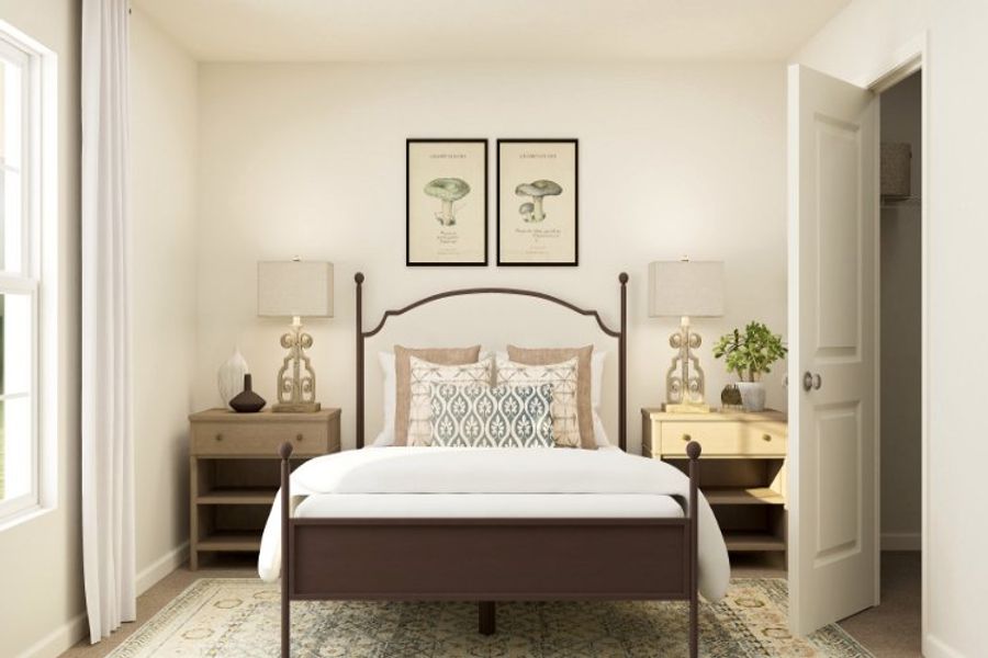 A bed with a white bed spread. A bed with a white bed spread.