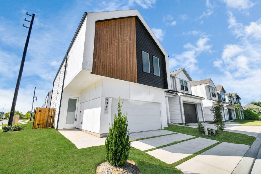 Front exterior of a new home in Antigua, Houston, TX, highlighting curb appeal (Image 27).