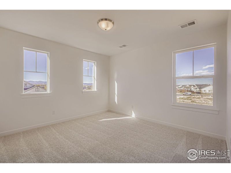 Spacious, unfurnished interior of a new home in RainDance - 60s, Windsor (Image 14).
