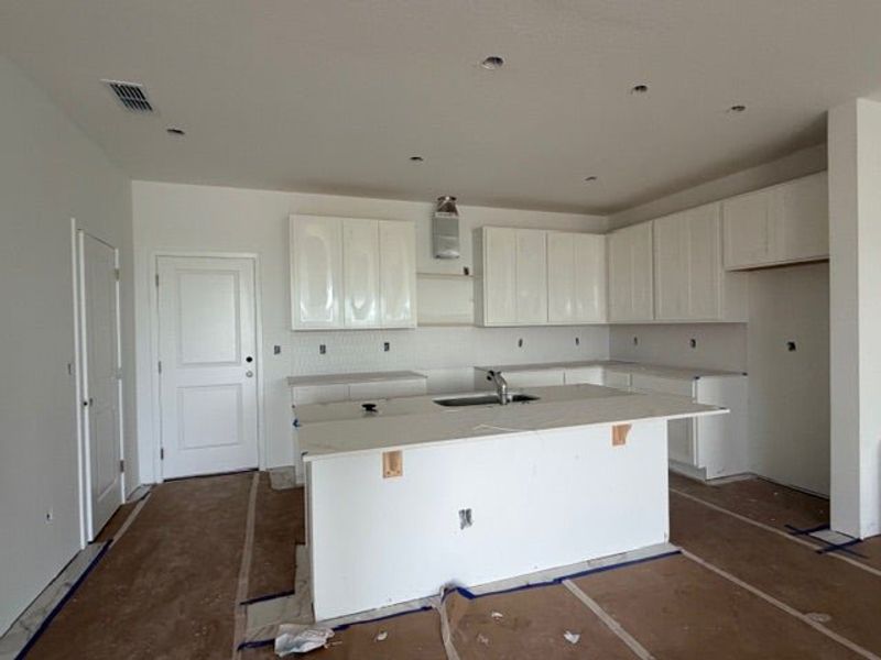 In-progress construction of a new home in Whaley Grove Townhomes, St. Cloud, FL (Image 12).