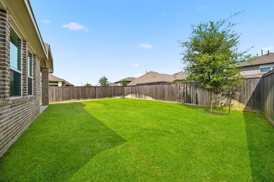 This expansive, private backyard offers a peaceful sense of seclusion with plenty of room to tailor this space to fit your lifestyle.