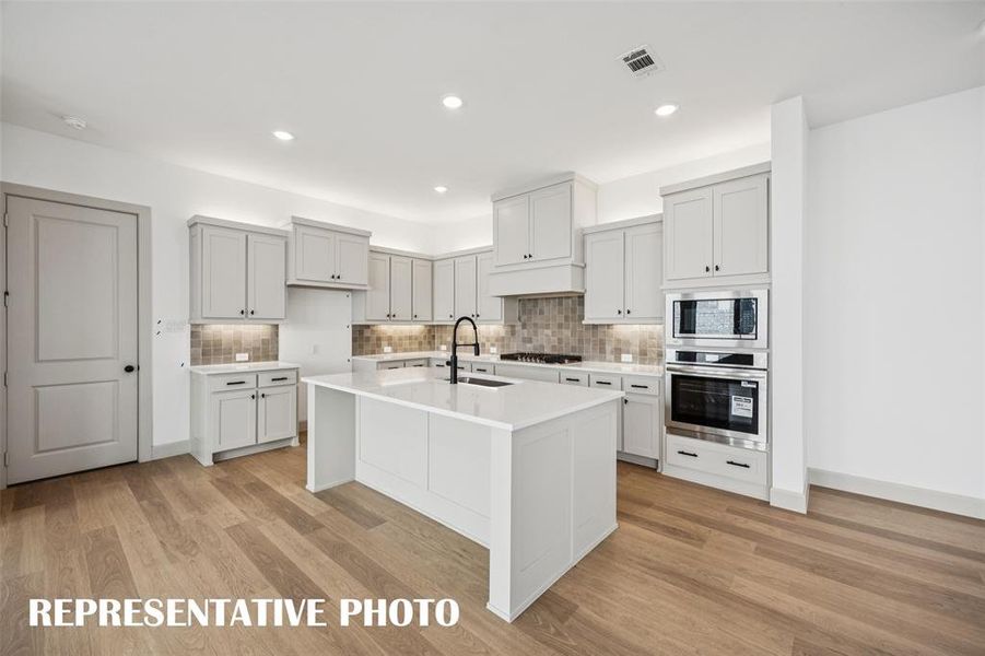 The spacious island is the hub of your new chef's kitchen and the perfect place for friends and family to gather round. REPRESENTATIVE PHOTO The spacious island is the hub of your new chef's kitchen and the perfect place for friends and family to gather round. REPRESENTATIVE PHOTO