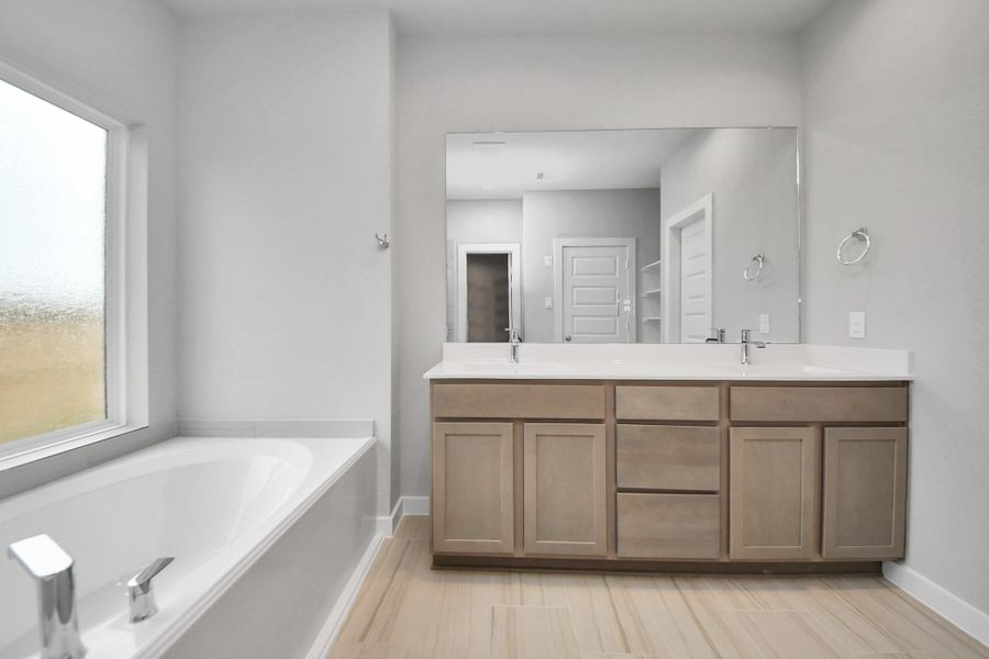 Elevate your dailyroutine at the elegant vanity, now equipped with double sinks, lightcountertops, modern hardware, and beautiful recessed lights. Sample photo of completed home with similar floor plan. Actual colors and selections may vary. Elevate your dailyroutine at the elegant vanity, now equipped with double sinks, lightcountertops, modern hardware, and beautiful recessed lights. Sample photo of completed home with similar floor plan. Actual colors and selections may vary.
