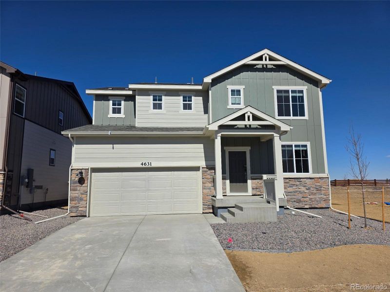 Front exterior of a new home in Revere at Johnstown, Johnstown, CO, highlighting curb appeal (Image 1). Front exterior of a new home in Revere at Johnstown, Johnstown, CO, highlighting curb appeal (Image 1).