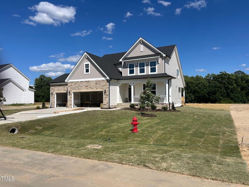 Front exterior of a new home in Tobacco Road, Angier, NC, highlighting curb appeal (Image 78). Front exterior of a new home in Tobacco Road, Angier, NC, highlighting curb appeal (Image 78).
