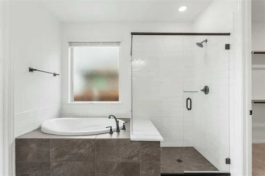The soaking tube & oversized shower with a built-in seat are just a couple of the extras this lovely home has to offer. Wait until you see the size of the walk-in closet!