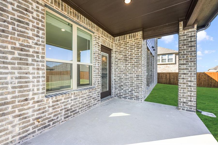 Exterior details and patio area of a home in Meadow Vista 60-65, Anna (Image 22). Exterior details and patio area of a home in Meadow Vista 60-65, Anna (Image 22).