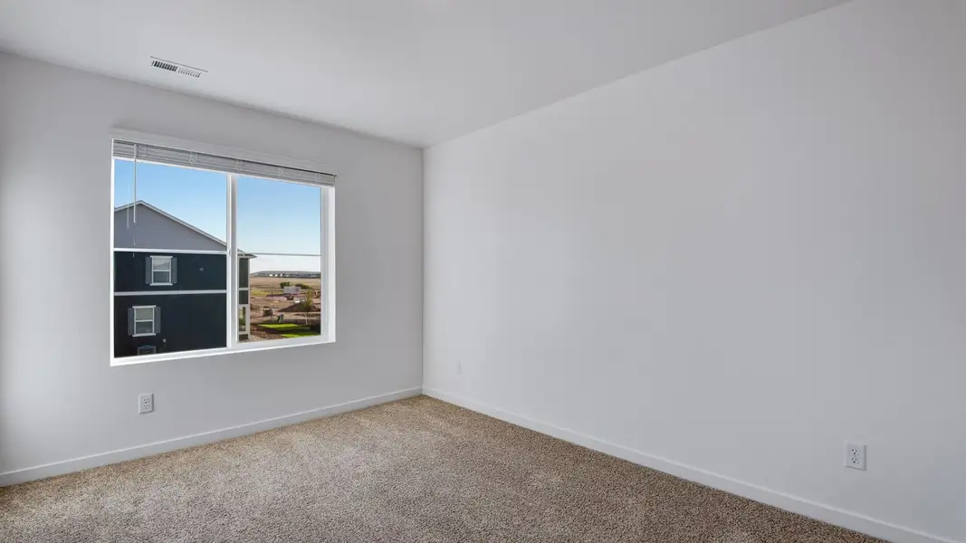 Spacious, unfurnished interior of a new home in Sky Ranch, Watkins (Image 14).