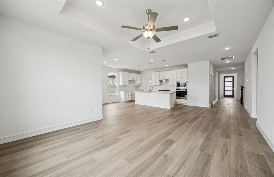 Open concept gathering room creating a spacious and inviting atmosphere *Real home pictured Open concept gathering room creating a spacious and inviting atmosphere *Real home pictured