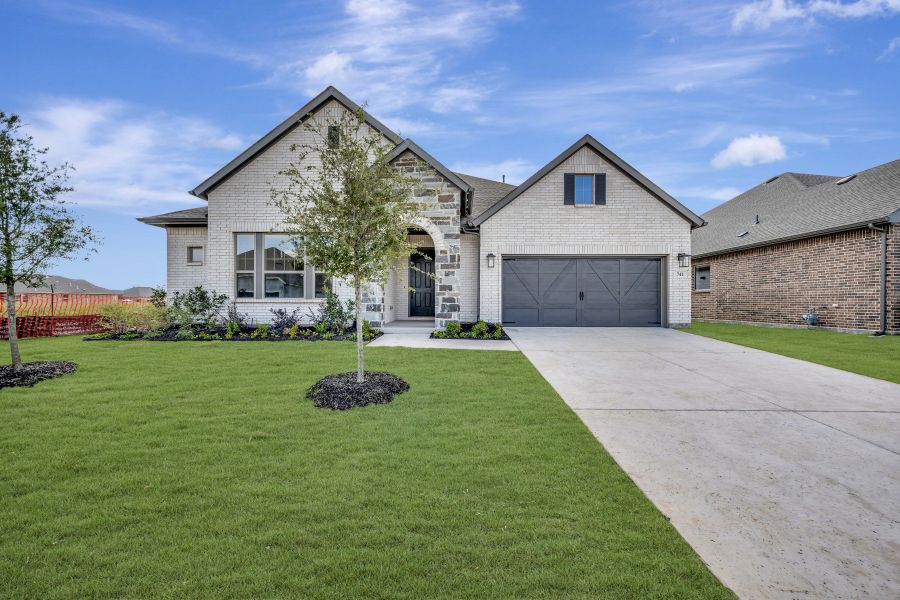Front exterior of a new home in Myrtle Creek, Waxahachie, TX, highlighting curb appeal (Image 1). Front exterior of a new home in Myrtle Creek, Waxahachie, TX, highlighting curb appeal (Image 1).