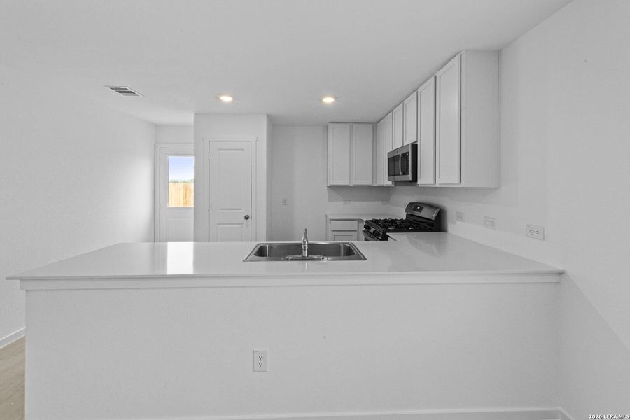 Furnished interior view inside a new home in Spring Grove, San Antonio (Image 9).