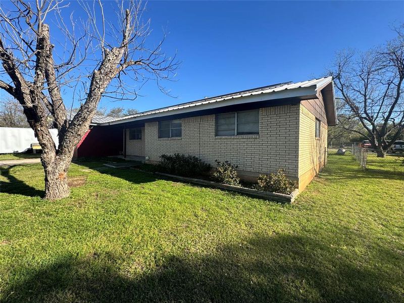 Exterior details and patio area of a home in , Brownwood (Image 2). Exterior details and patio area of a home in , Brownwood (Image 2).