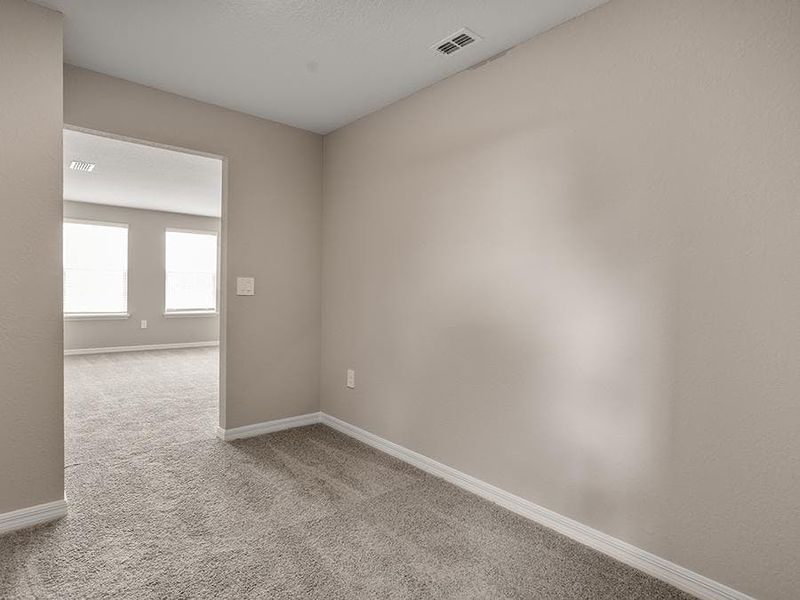 Upstairs, enter your owner`s suite through a private owner`s retreat - Brynn bungalow by Highland Homes